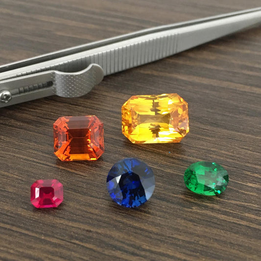 Emerald Cut Yellow Sapphire, Oval Shape Tsavorite, Round Shape Blue Sapphire, Emerald Cut Orange Sapphire & Emerald Cut Ruby