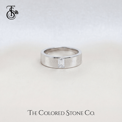 Silver men's wedding ring with a diamond on a light gray background, featuring 'The Colored Stone Co.' branding.