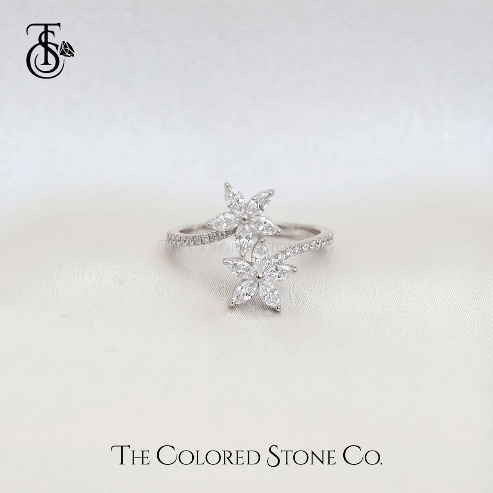 Star-shaped diamond ring on a light gray background with 'The Colored Stone Co.' branding.