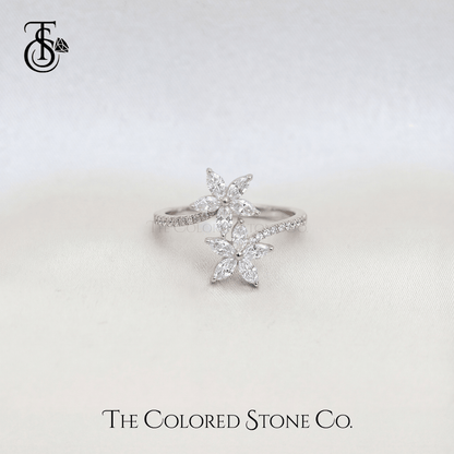 Star-shaped diamond ring on a light gray background with 'The Colored Stone Co.' branding.