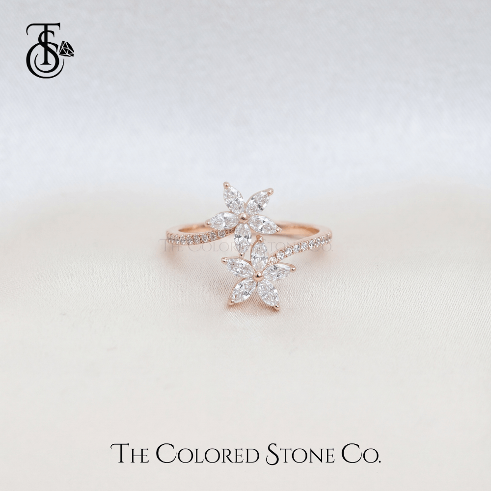 Rose gold ring with diamond accents on a light background, featuring The Colored Stone Co. logo.