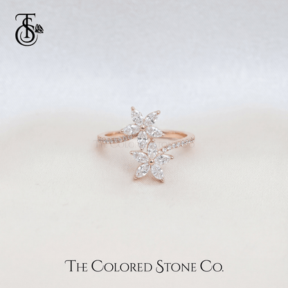 Rose gold ring with diamond accents on a light background, featuring The Colored Stone Co. logo.