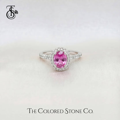 white gold engagement Ring with a pink sapphire gemstone on a white background, featuring 'The Colored Stone Co.' branding.