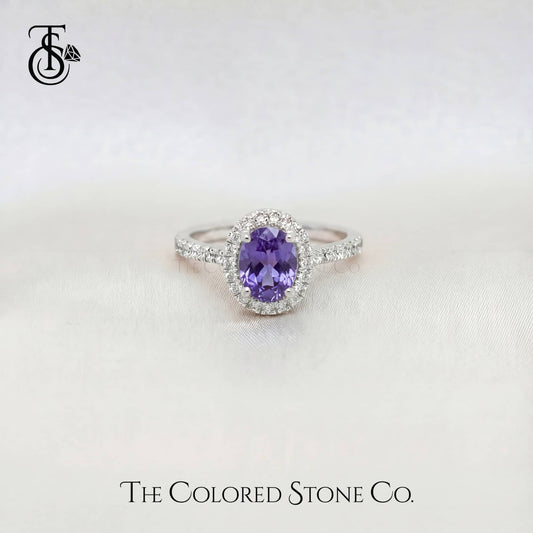 White gold sapphire Ring with a purple sapphire gemstone on a white background, branded 'The Colored Stone Co'.