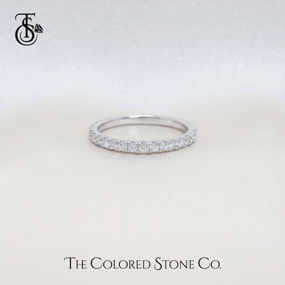 white gold Diamond wedding ring with small stones on a light gray background, featuring 'The Colored Stone Co.' branding.