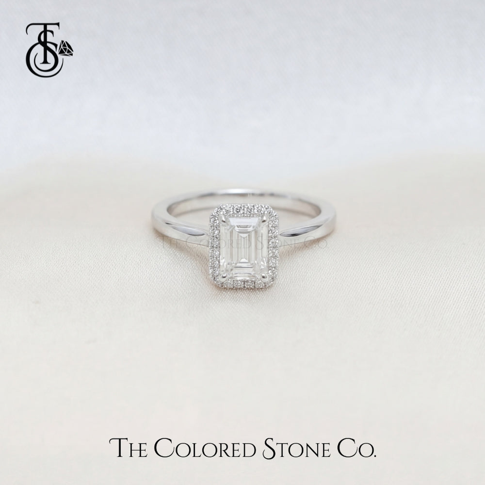 White Gold Engagement ring with a diamond on a light background, featuring 'The Colored Stone Co.' branding.
