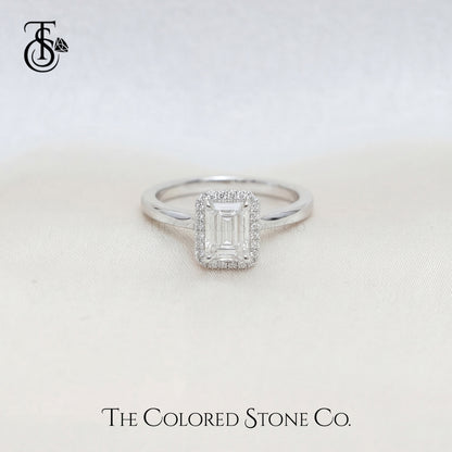White Gold Engagement ring with a diamond on a light background, featuring 'The Colored Stone Co.' branding.